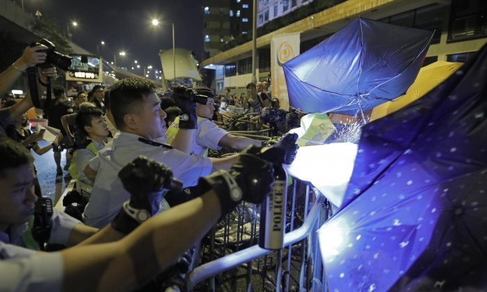 Protesters march amid ongoing demonstrations in Hong Kong on Nov. 6, 2016. (ISAAC LAWRENCE/AFP/Getty Images)